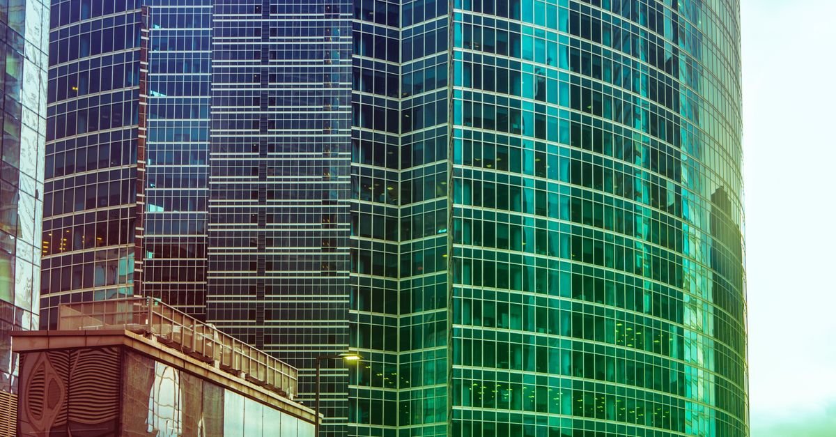 LLM Agents for Building Energy Models: Tool-Augmented Beats Autonomous
