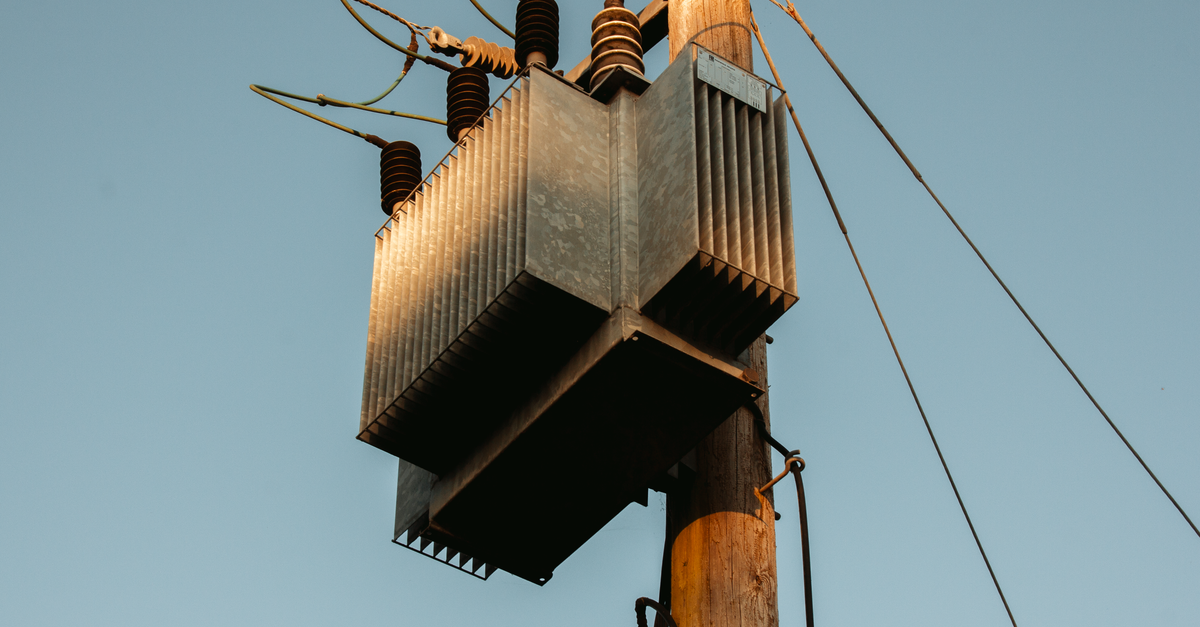Physics-Informed AI Coordinates EV Inverters for Voltage Stability