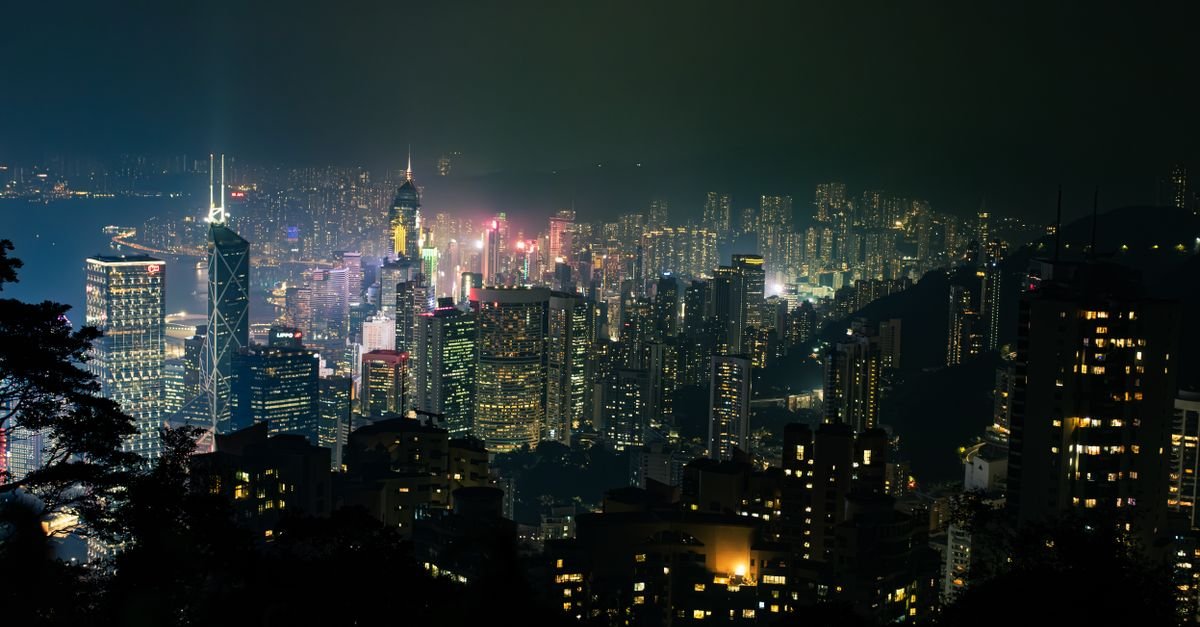 Urban Zero-Carbon Grids via Building Flexibility and Regional Power Sharing